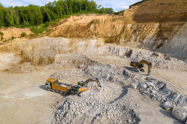 open-pit-mining-of-construction-sand-stone-materials-with-excavators-and-dump-trucks